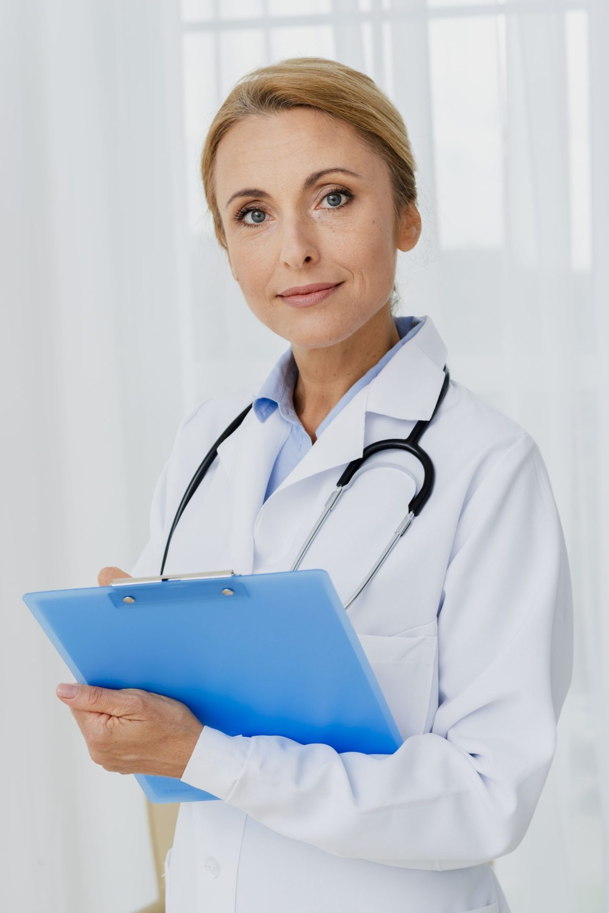doctor-holding-clipboard-looking-camera(1)